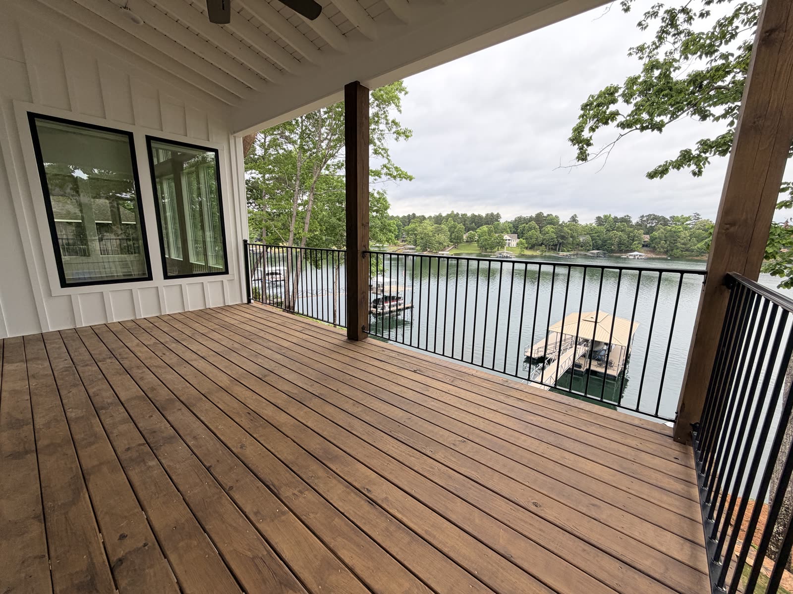 Covered porch overlooking the lake at Boardwalk Bliss