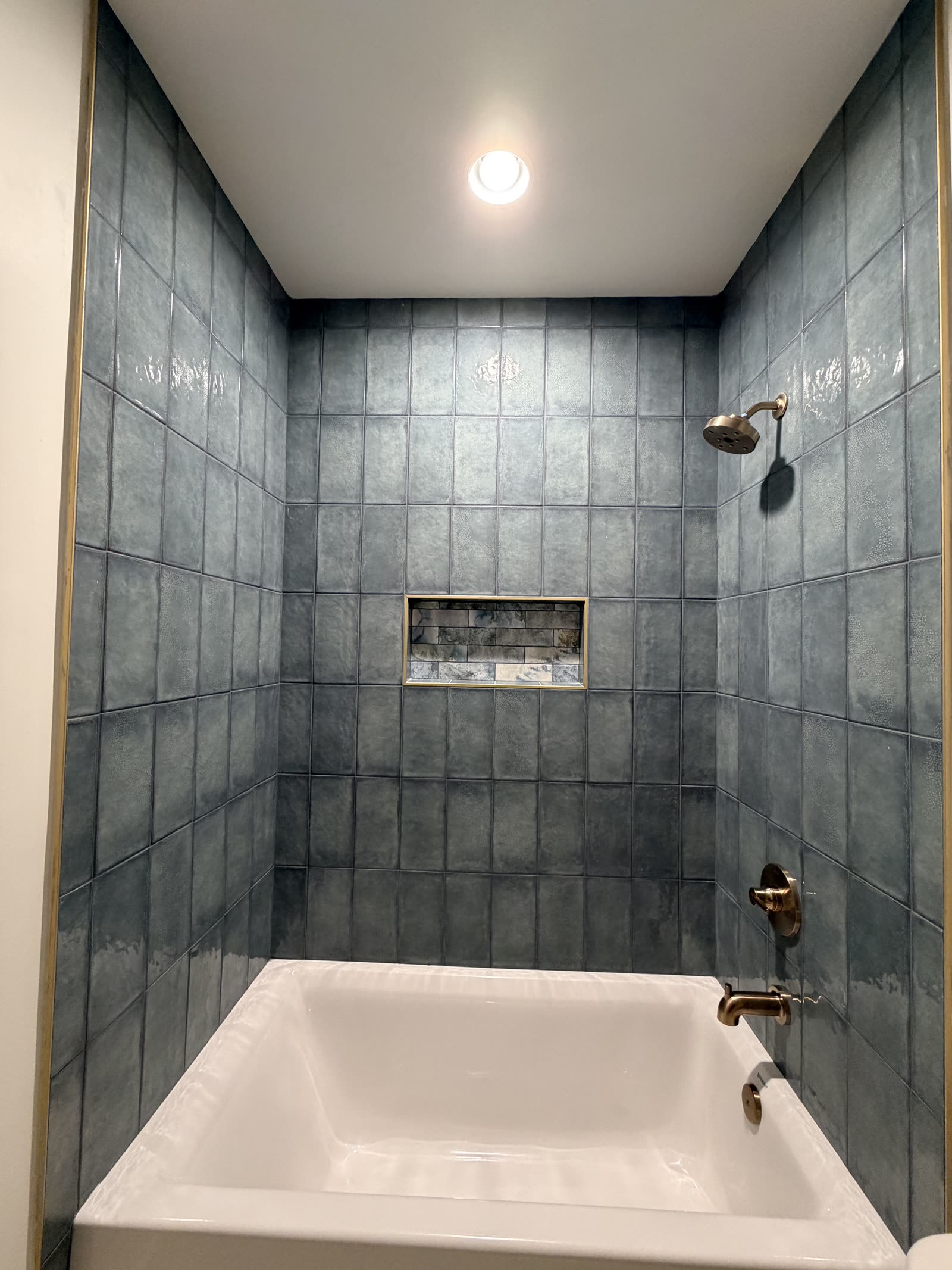 Blue tiled shower at Boardwalk Bliss