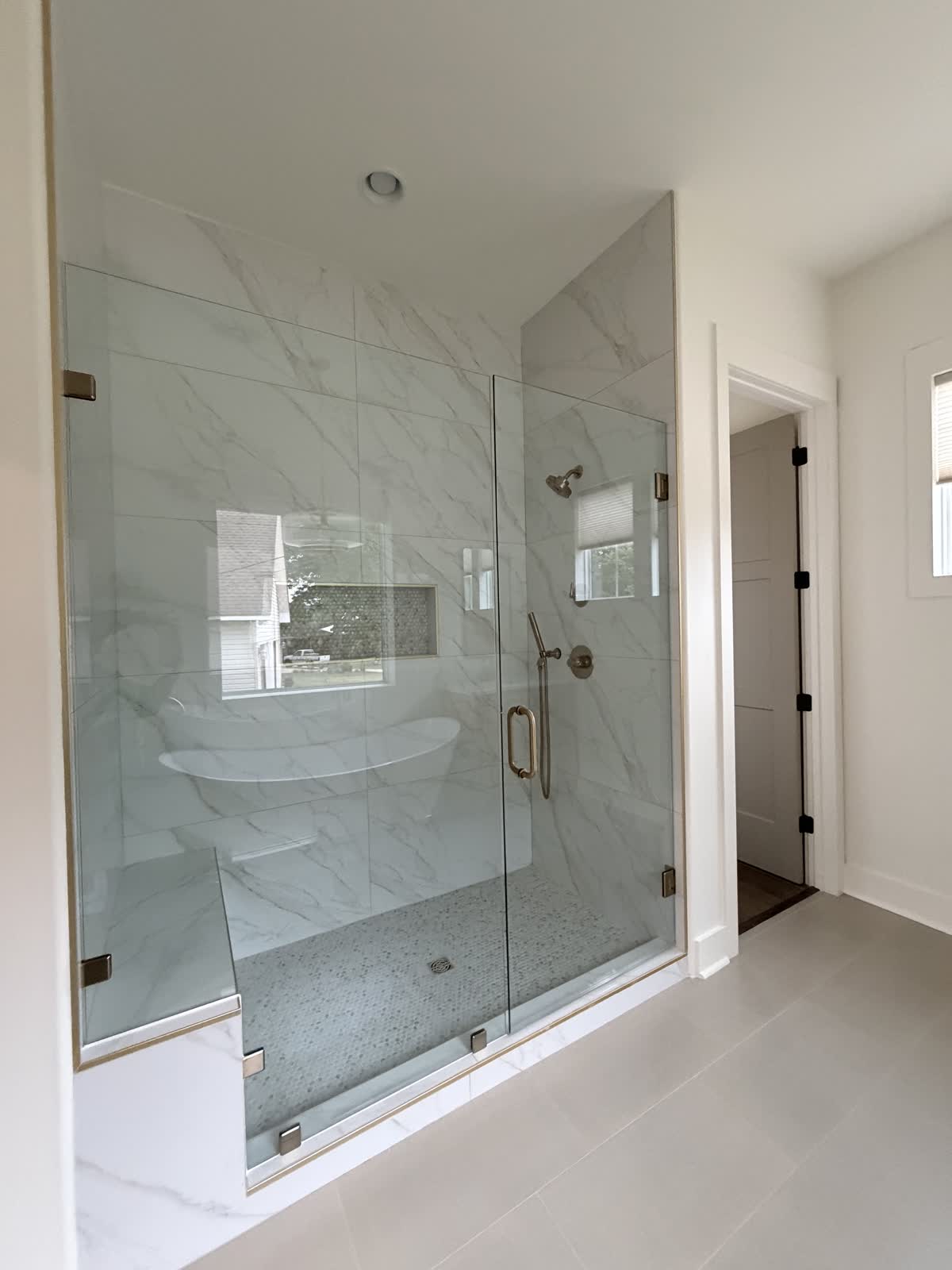 Marble shower and tub at Boardwalk Bliss