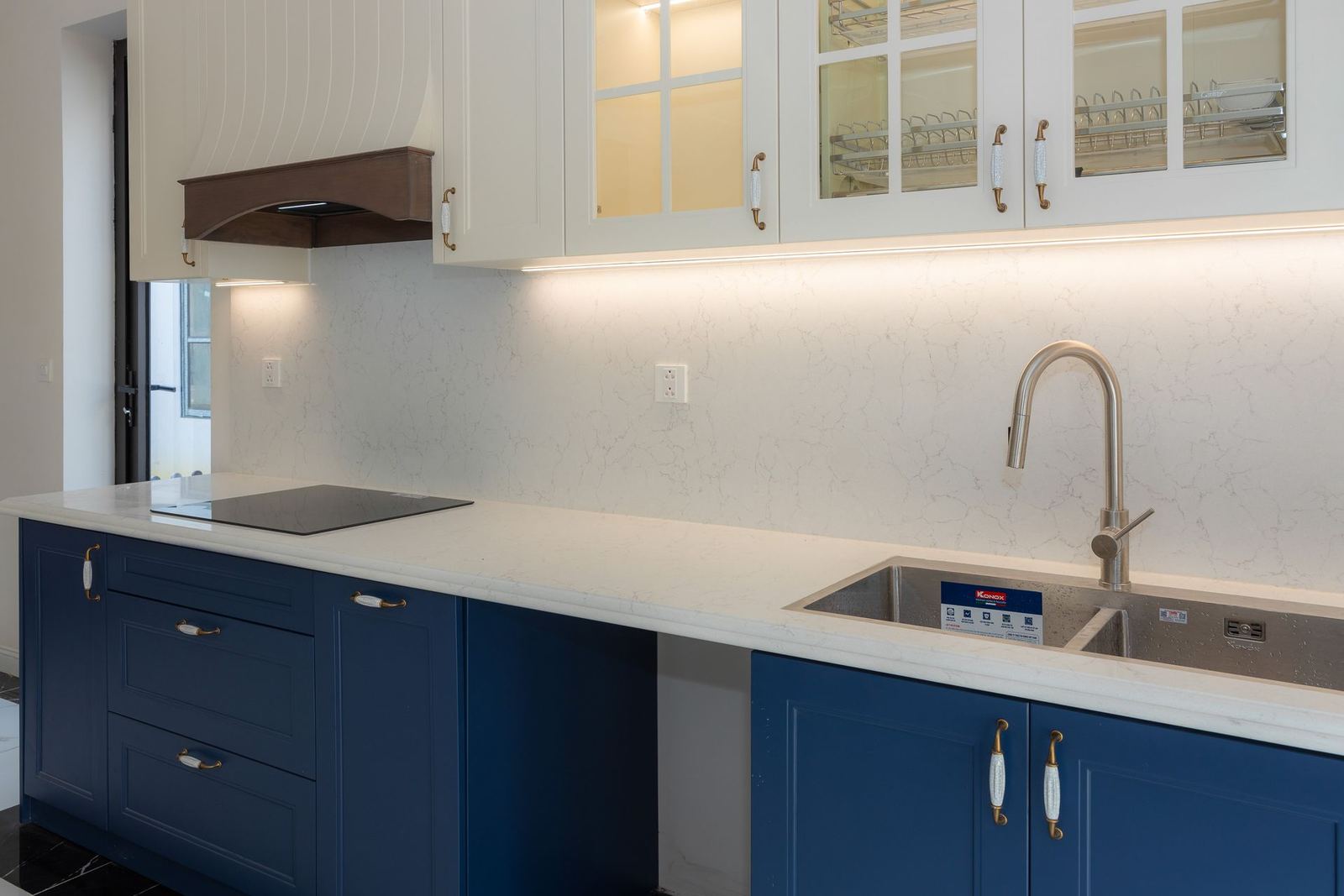 Kitchen with navy lower cabinets