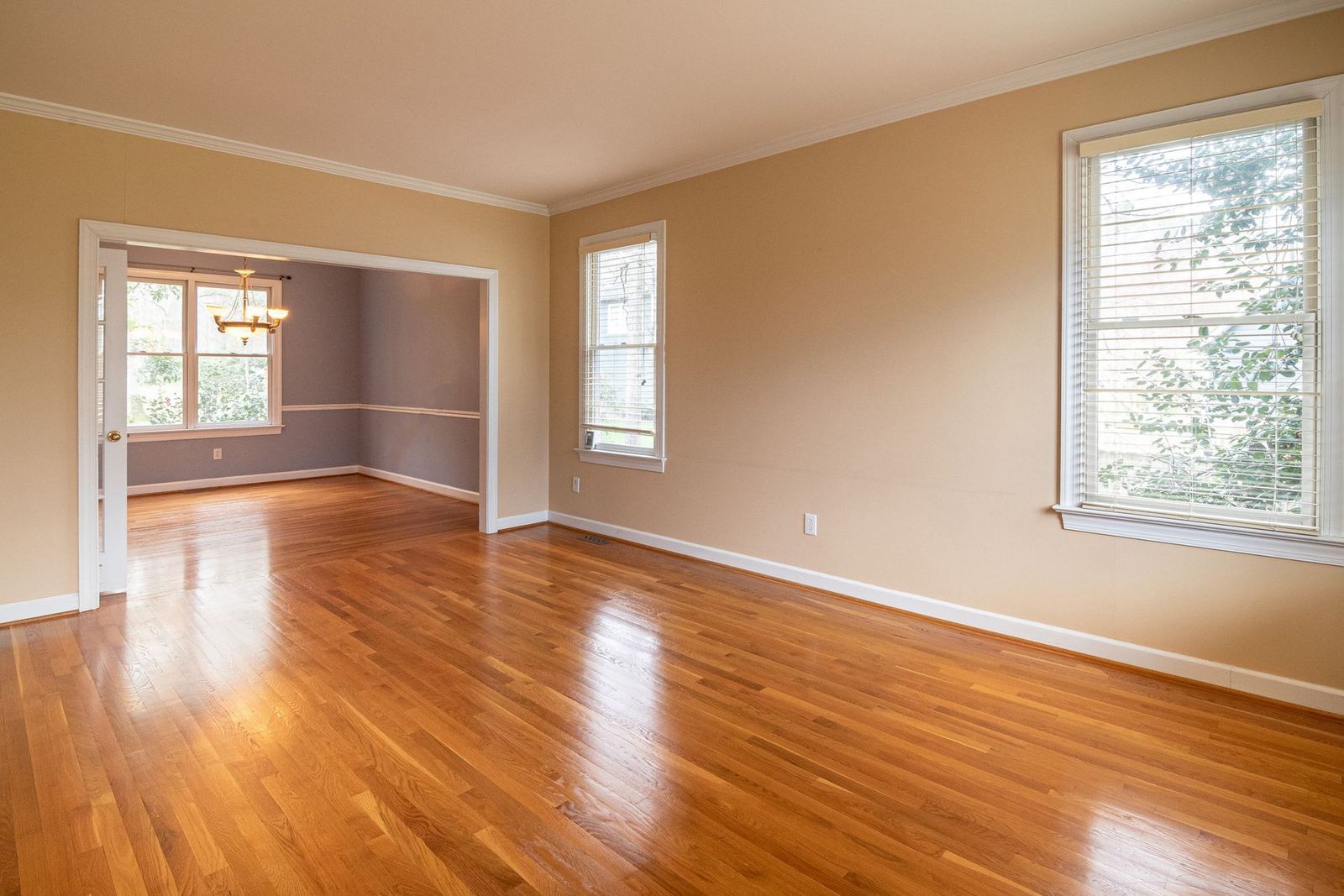 Empty room with warm hardwood floors