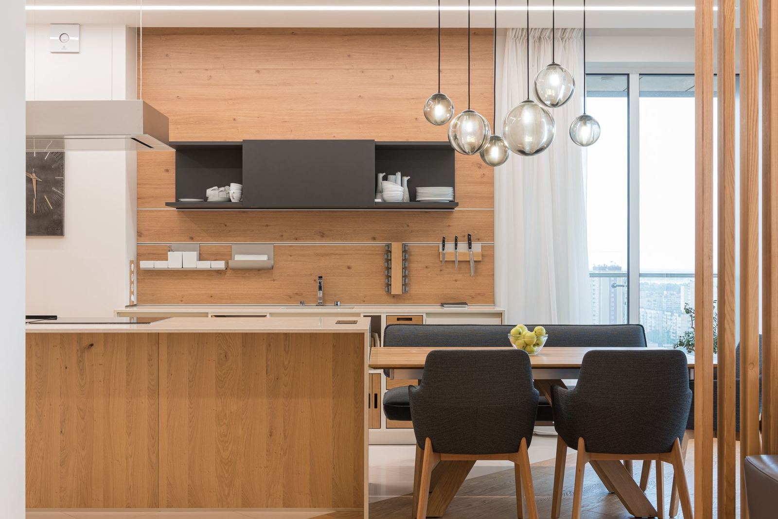 Glass pendant lights over a dining area